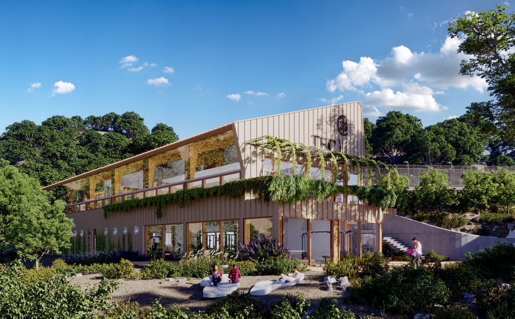 Recreación del edificio principal del TEC, con fachada de madera, cubierta vegetal y jardín de plantas autóctonas